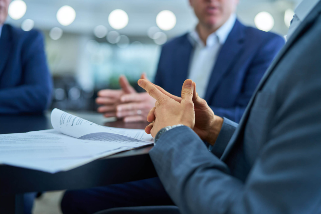 zach-handelman-hands-during-meeting