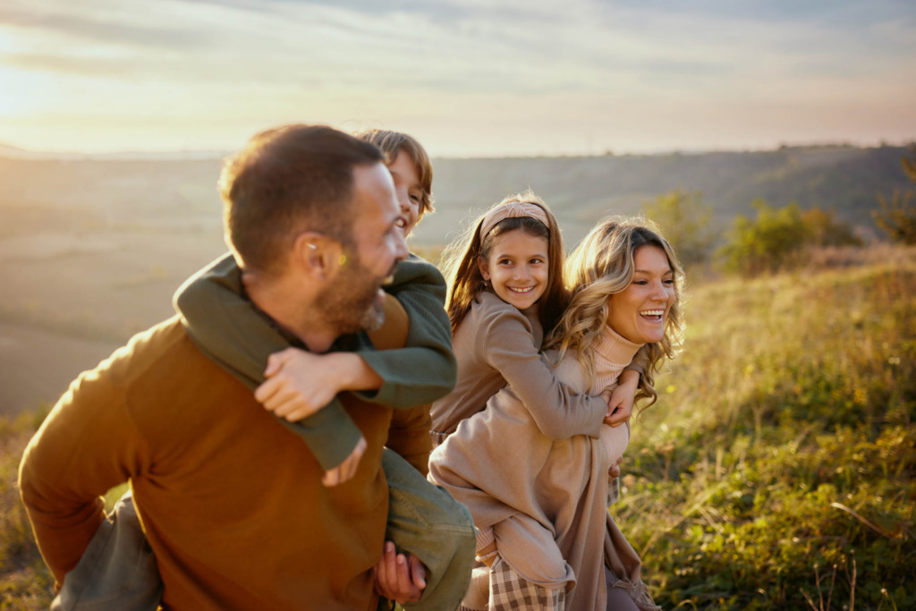 young-family-playing-with-two-daughters-outdoors